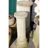 A reconstituted stone reeded column 79cm high and another smaller
