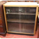 A modern oak glazed bookcase 99cm high, 92cm wide and a 19th Century mahogany side table with a