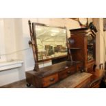 A 19th Century mahogany toilet mirror with three short drawers