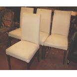 A set of four modern dining chairs