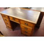 A late Victorian mahogany pedestal desk with writing surface and nine drawers 77cm high, 122cm wide