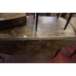 A 19th Century mahogany oval drop leaf table, 19th Century mahogany toilet mirror and an