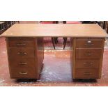 A mid 20th Century pedestal desk with eight drawers 74cm high, 153cm wide