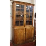 An oak glazed bookcase 220cm high, 126cm wide