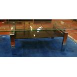 A glass topped coffee table with chrome supports and two pairs of modern lamps (sold as parts)