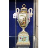 A Vienna potpourri urns with pierced covers, swan neck handles with Watteau Esque figures, 34cm