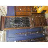 A narrow early 20th century mahogany glazed bookcase 140cm high, 71cm wide