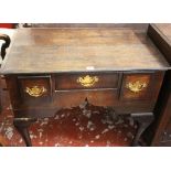 A George II and later oak lowboy with three frieze drawers on cabriole legs 82cm wide