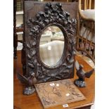 A carved wooden mirror, two carved birds and a carved wooden panel