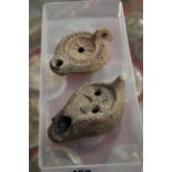 Two Roman oil lamps