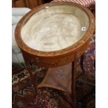 An oval satinwood and polychrome decorated bijouterie table with an undertier 78cm high, 62cm wide