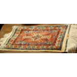 A Central Persian silk and metal thread rug signed and dated 58 x 37cm