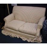 An upholstered sofa in check upholstery