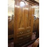 An Edwardian mahogany and crossbanded triple wardrobe 122cm high, 260cm wide