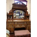 An Edwardian mirror back mahogany sideboard with drawers and cupboards below stamped 'Walker &