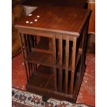 An Edwardian mahogany and crossbanded revolving bookcase 83cm high