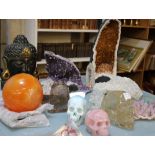 A large amethyst quartz geode, other crystal geodes, assorted crystals and a small occasional table