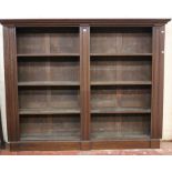 A mahogany bookcase the shelves flanked by pilasters 177cm high, 225cm