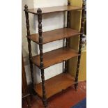 A Victorian mahogany four tier what-not with shaped tiers joined by turned supports 122cm high, 60cm