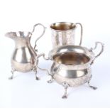 Silver: A Christening Cup, makers Robert & Dore, London 1912, a cream jug and a double handled sugar