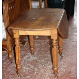 A Continental pine drop leaf dining table and set of four pine dining chairs