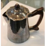 A 20th Century silver lidded jug, with wooden handles, maker John Joyce, unhallmarked, workshop