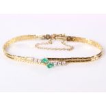 An 18ct gold, diamond and emerald bracelet, 9.4g in total