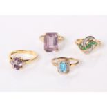 An 18ct gold amethyst ring flanked by two small diamonds, a 9ct gold emerald and diamond cluster