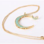 A 18ct gold crescent pendant with turquoise stones and a single matching earring (2)