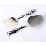 Silver: A pair of Georg Jensen fish servers with entwined fish handles and shell terminals,