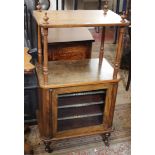 A Victorian walnut music cabinet with a raised upper section 110cm high, 58cm wide