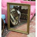 A gilt framed mirror 85cm high, 69cm wide and a mahogany oval example