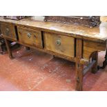 A Chinese stained pine three drawer side table on square supports. 216 cm