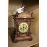 A Victorian style oak cased bracket clock.