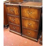 A pair of reproduction three drawer folio cabinets