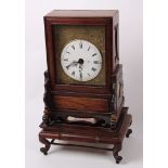 An early 20th century rosewood cased mantel clock, having striking double fusee movement, the