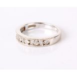 An 18ct white gold and diamond half eternity ring, marked Iliana to shank, 4g in total