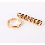 An 18ct gold wedding band, 3.8 grams and a rope twist tie pin with 9 carat stamped to the pin.