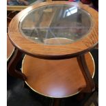 A pair of modern two tier glass topped coffee tables