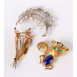 A Chinese cat brooch, marked 14K, a fern shaped brooch, marked 14K and another brooch (3)