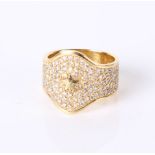 A modern 18ct gold and diamond encrusted ring, marked cb to shank, 4.9g