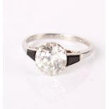 An early 20th Century diamond and platinum solitaire ring, inscribed to shank 'In Memory of my