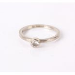 An 18ct white gold and diamond solitaire ring, 2.4g in total