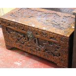 A Chinese camphorwood carved chest 89cm wide