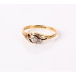 An 18ct gold and diamond three stone ring, one diamond missing, 1.9g in total