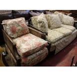 An early 20th Century mahogany and caned bergere suite the arms terminating in rams heads