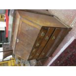 A George III mahogany bureau with a fitted interior, two short and three long drawers on bracket