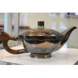 Silver; A 20th Century silver teapot, with wooden handle, maker John Joyce, London 1985, 22.8 troy