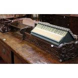 A floral carved oak book trough with the Works of English Poets , a small book stand and two spindle