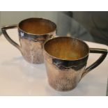 Silver; A pair of 20th Century silver mugs, maker John Joyce, unhallmarked, workshop pieces, 16.5